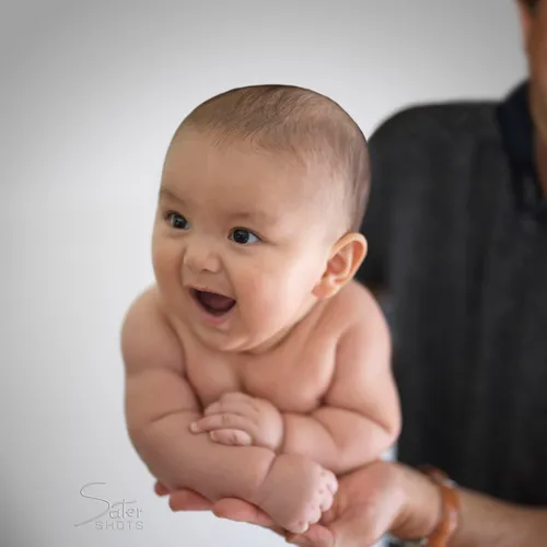A baby swung by the father